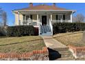 Inviting single-Gathering home with a covered front porch and brick retaining wall at 516 W 7Th St, Kannapolis, NC 28081