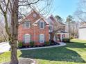 Well-maintained brick home with a welcoming covered porch and manicured landscaping at 5405 Silver Creek Dr, Waxhaw, NC 28173