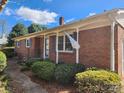 Classic brick home with blue shutters and a welcoming front porch at 105 Brickyard Rd, Fort Mill, SC 29715