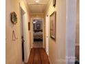 Inviting hallway with hardwood floors and a view into the bedroom at 105 Brickyard Rd, Fort Mill, SC 29715