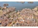 Stunning aerial view of waterfront homes nestled among lush trees and tranquil waters at 11 Heritage Ln, Shelby, NC 28150