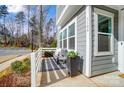 Charming front porch with seating, stylish decor, and a well-maintained exterior, perfect for enjoying the outdoors at 118 Isleworth Ave, Mooresville, NC 28117