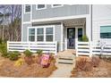 Cozy front porch with a sitting area and a well-decorated entrance, perfect for relaxing outdoors at 118 Isleworth Ave, Mooresville, NC 28117