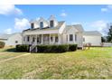 Side view of a lovely two-story home with a manicured lawn, front porch, and detached garage at 1249 Maddy Ln, Rock Hill, SC 29732