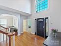 Bright foyer with gleaming hardwood floors and ample natural light at 15715 Holyhead Ln, Huntersville, NC 28078