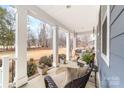 Relaxing front porch with rocking chairs, swing, and picturesque views at 158 Country Lake Dr, Mooresville, NC 28115