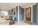 Charming front porch with seating, a swing, and welcoming decor offers curb appeal at 158 Country Lake Dr, Mooresville, NC 28115
