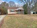 Inviting single-story home featuring a covered porch and landscaped front yard at 220 Valleyview Pl, Salisbury, NC 28144
