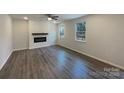 Spacious living room features a modern fireplace, hardwood floors, and plenty of natural light at 2236 Sussex Rd, York, SC 29745