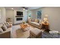 Bright living room with fireplace, plush seating, hardwood floors and ample natural light at 2236 Sussex Rd, York, SC 29745