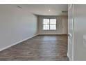 Inviting living room featuring laminate floors and a bright window at 299 Berrybeth Cir, China Grove, NC 28023