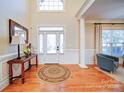 Inviting foyer with hardwood floors, natural light, and stylish decor at 4763 River Hills Dr, Denver, NC 28037