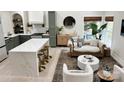Open concept living space with kitchen island, modern furnishings, and decorative rug at 5057 Murrayhill Rd, Charlotte, NC 28210