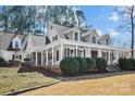 Lovely traditional home with long porch, stone accents, and a well-manicured lawn at 607 Beaten Path Rd, Mooresville, NC 28117