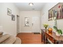 Bright foyer with hardwood floors, a console table, and a decorated wall at 9018 Seamill Rd, Charlotte, NC 28278