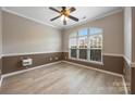 Comfortable bedroom with a large window providing natural light and attractive flooring at 10933 Sedgemoor E Ln, Charlotte, NC 28277