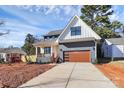 Attractive two-story home with modern garage and inviting porch on a new-construction lot at 1210 Skyview Rd, Charlotte, NC 28208