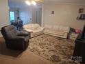 Cozy living room featuring comfortable seating and a patterned rug at 1245 Forest Ridge Rd, Bessemer City, NC 28016