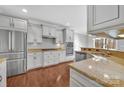 Bright kitchen featuring stainless steel appliances, granite countertops, and white cabinetry at 141 Planters Dr, Statesville, NC 28677