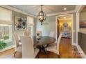 Elegant dining room featuring a round table, chandelier, and stylish decor, ideal for gatherings at 1426 Merrimont Ave, Kings Mountain, NC 28086