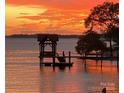 Water view with boathouse and vibrant sunset colors at 17811 Half Moon Ln # C, Cornelius, NC 28031