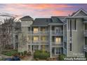 Inviting condo building with multiple floors and private balconies in a beautifully landscaped complex at 18832 Nautical Dr # 44, Cornelius, NC 28031