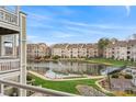 Scenic view of a tranquil lake surrounded by condos and lush greenery at 18832 Nautical Dr # 44, Cornelius, NC 28031