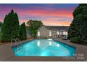 Sparkling in-ground pool surrounded by lush greenery, ideal for relaxation and entertainment at 196 Gabriel Dr, Mooresville, NC 28115
