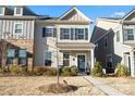 Charming two-story home with gray shutters, covered front porch, and winter landscaping at 2147 Stevens Mill Rd, Matthews, NC 28104