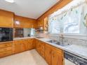 Traditional kitchen with wood cabinets, laminate countertops, and stainless steel appliances at 2310 Clay St, Kannapolis, NC 28083