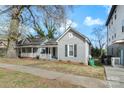 Traditional home with a covered porch and neat landscaping at 312 Flint St, Charlotte, NC 28216