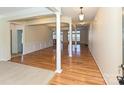 Bright living room with hardwood floors and white columns, showcasing a spacious and open-concept design at 315 Drake Park Ave, Fort Mill, SC 29708