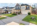 Beautiful home with a well-manicured lawn, long driveway, and an attached two-car garage at 3449 Southern Red Oak Ln, Gastonia, NC 28056