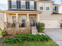 Inviting front porch with stylish railings and space for seating, leading to the home's entrance at 3449 Southern Red Oak Ln, Gastonia, NC 28056