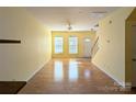 Spacious living room features hardwood floors and plenty of natural light through large windows at 3812 York Aly, Lake Park, NC 28079