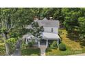 Picturesque aerial view of a home nestled among trees with a charming front porch at 401 W Hoke St, Landis, NC 28088