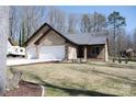 Charming brick home featuring an attached two-car garage and a well-manicured front lawn at 4531 Deer Run None, Rock Hill, SC 29732