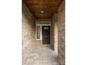 Inviting front porch featuring a dark wooden ceiling and a solid front door at 4531 Deer Run None, Rock Hill, SC 29732