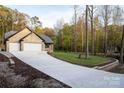 Inviting brick home boasts an extra-long driveway and lush, landscaped front yard at 4531 Deer Run None, Rock Hill, SC 29732