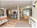 Open-concept living space with modern furnishings and a view into the updated kitchen area at 5091 Windward Dr, Tega Cay, SC 29708
