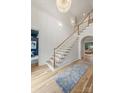 Elegant foyer with hardwood floors, staircase, designer runner, and open access to other rooms at 5124 Lansing Dr, Charlotte, NC 28270