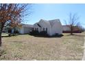 A cozy home with a well-maintained yard under a clear blue sky at 5809 Carolina Manor Ct, Indian Trail, NC 28079