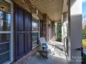 Inviting front porch with rocking chair seating, perfect for enjoying the outdoors at 8017 Talcott Dr, Mint Hill, NC 28227