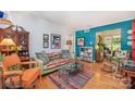 Cozy living room with a fireplace, hardwood floors, and stylish decor at 912 Mcalway Rd, Charlotte, NC 28211
