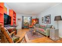 Bright living room with hardwood floors, colorful decor, and comfortable seating arrangement at 912 Mcalway Rd, Charlotte, NC 28211