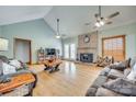 Spacious living room with high ceilings, fireplace, wood floors, and abundant natural light at 1221 Edgefield Rd, York, SC 29745