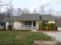 Charming single-story home featuring a cozy front porch and well-maintained landscaping at 14440 W Highway 55 Hwy, Blacksburg, SC 29702
