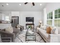 Living room features modern décor, a comfortable sofa, and an entertainment area with a TV at 1505 W May Ave, Gastonia, NC 28052