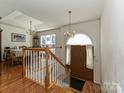 Bright foyer with hardwood floors, stairs, and a view of the dining area at 2339 Perry Rd, Denver, NC 28037