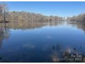 Scenic lake view provides serene backdrop, enhancing property's tranquility and natural beauty at 805 Stack Rd, Monroe, NC 28112